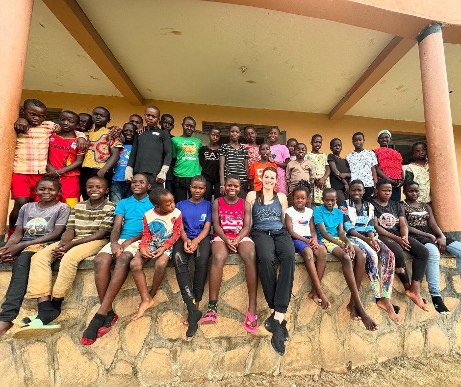 Students and instructors gathered outside the Uganda studio