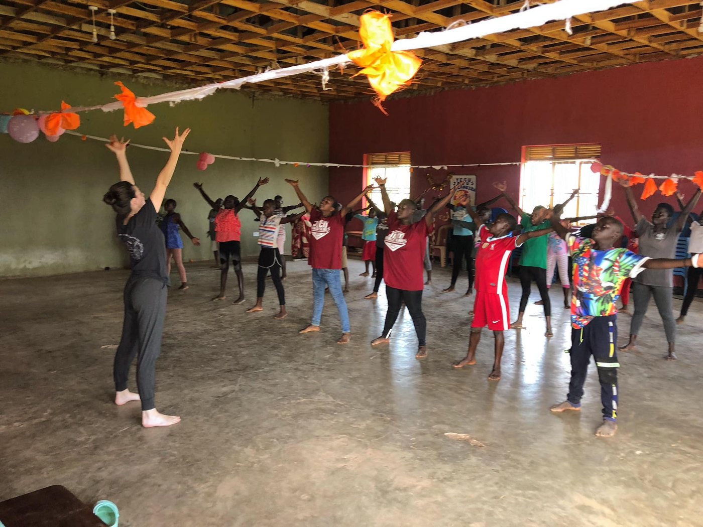 A group practicing dance together inside the studio