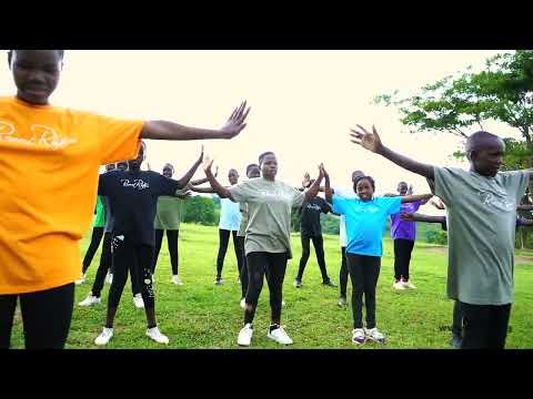 Students dancing outdoors in Rise Up
